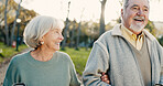 Senior couple, park and morning walking with conversation, love and bonding together with health. Wellness, marriage and retirement with outdoor, communication and chat on urban garden path on date