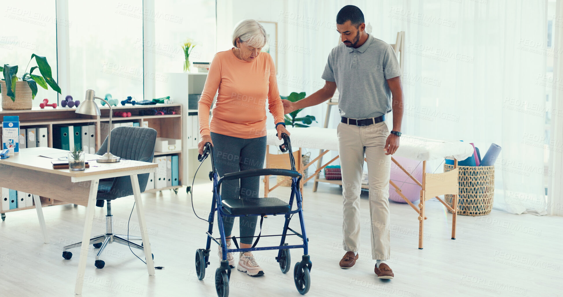 Buy stock photo Physiotherapy, walking frame and man with patient for rehabilitation, mobility and medical service. Healthcare, recovery and chiropractor with senior woman for help, wellness and physical therapy