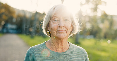 Buy stock photo Senior, woman and smile in portrait at park for morning walk, wellness and confidence in retirement. Elderly person, face of pensioner and happy in nature for relax, lens flare and pride in street