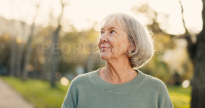 Buy stock photo Walking, thinking and mature woman in park for wellness, health and relax with reflection, nostalgia and daydreaming. Retirement, nature and senior person outdoors for fresh air, smile and calm