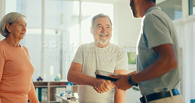 Buy stock photo Physiotherapist, tablet and mature man with handshake for thank you, consulting and medical help. Healthcare, chiropractor and patient on digital tech for physical therapy, recovery and online report