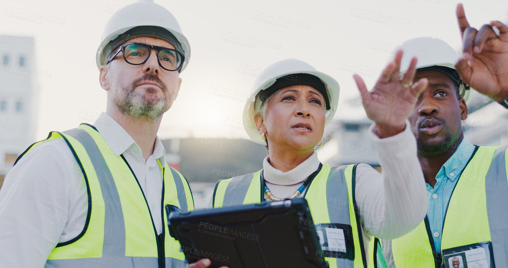 Buy stock photo Pointing, group and people in construction with tablet, collaboration and inspection in civil engineering. Project manager, contractor and architect on site checking quality assurance with teamwork