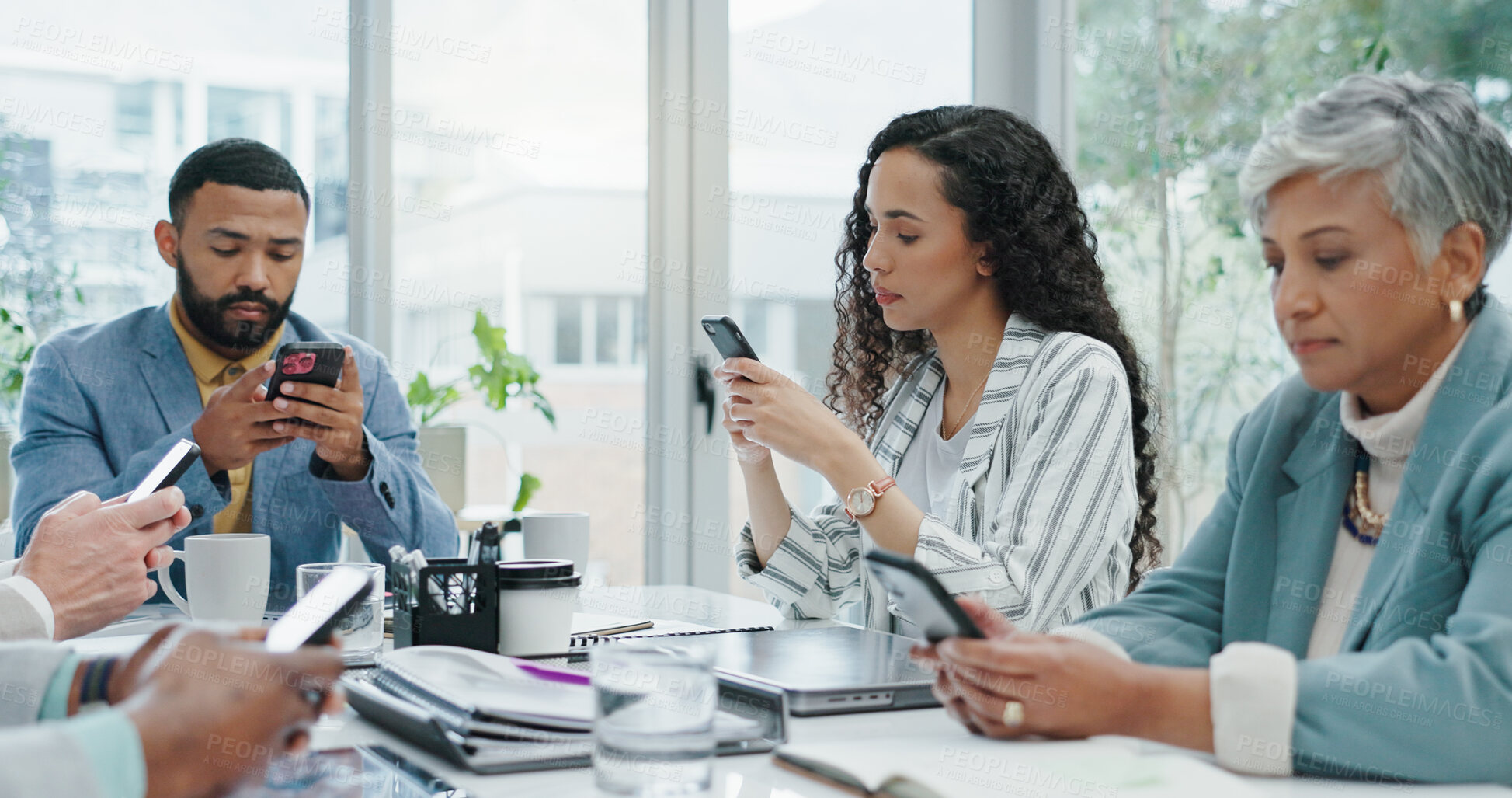 Buy stock photo Phone, typing and distracted business people in office checking email, social media or online chat. Communication, connectivity and careless team in conference room with smartphone, addiction or risk