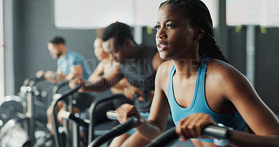 Buy stock photo People, fitness and stationary bike at gym for exercise, training and workout with sweat. Cycling machine, energy and building muscles with cardio for health, self care and wellbeing with motivation