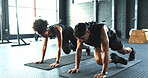Fitness, training and workout with couple on floor of gym together for cardio, core or intensity. Active, exercise or mountain climbers with man and woman in health club for challenge or performance