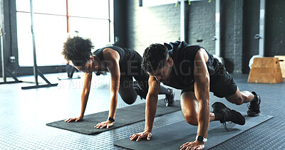 Buy stock photo Fitness, training and workout with couple on floor of gym together for cardio, core or intensity. Active, exercise or mountain climbers with man and woman in health club for challenge or performance