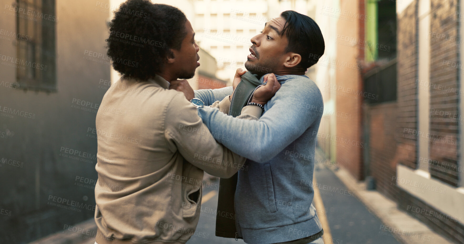 Buy stock photo Anger, fighting or threat with men in city for aggressive disagreement, physical harm and violence. Bullying, conflict and fear with enemy people outdoor in urban town for frustration or harassment