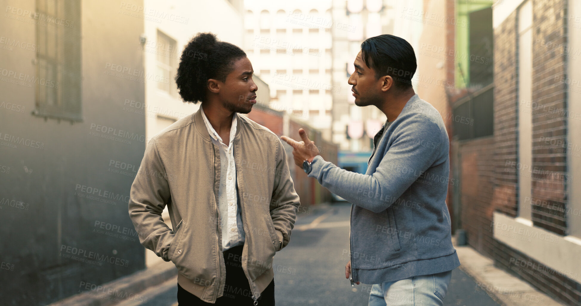 Buy stock photo Angry, argument and men fighting in city with threat for aggressive disagreement, physical harm and violence. Upset, conflict and male people outdoor with danger in urban town alley with frustration.