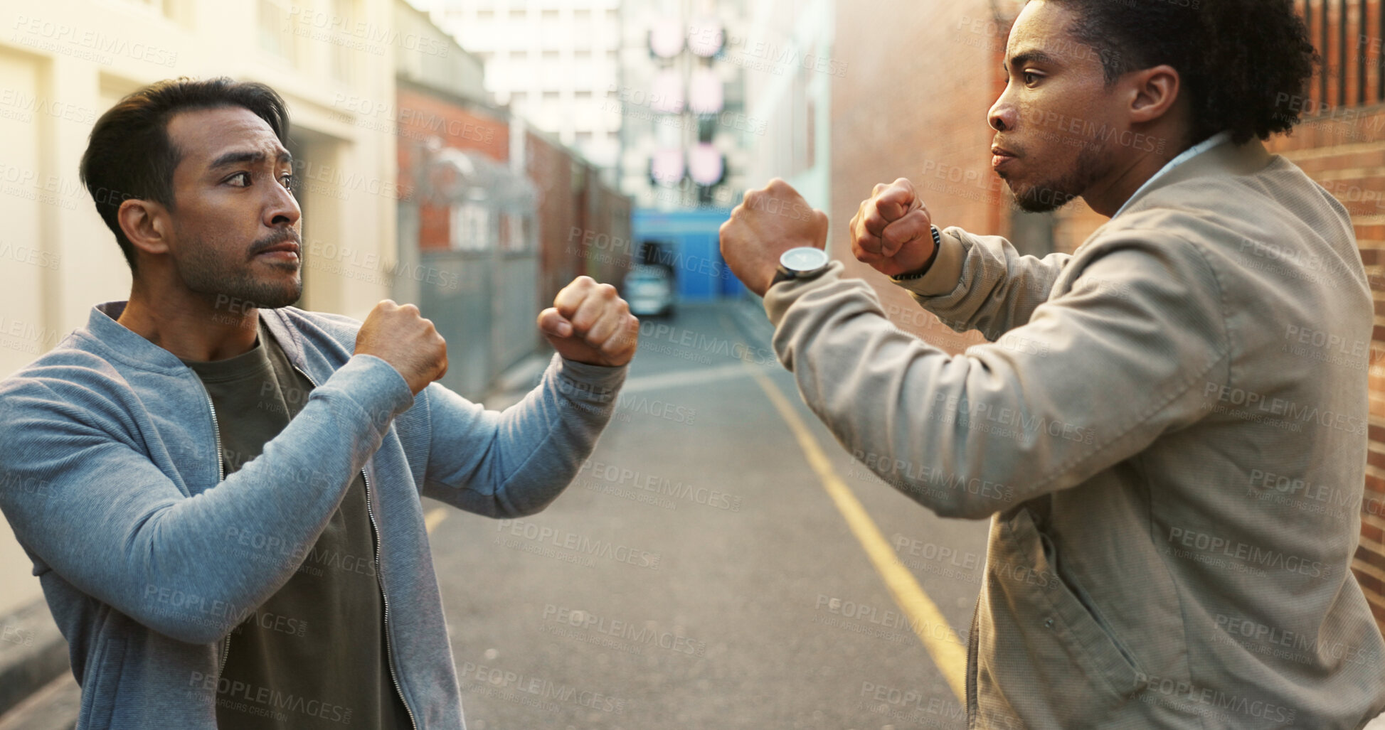 Buy stock photo Angry men, city and fight for conflict, violence and disagreement or bullying in alley. Battle, fist and people with problem, argument and aggression with self defense outdoor brawl in street