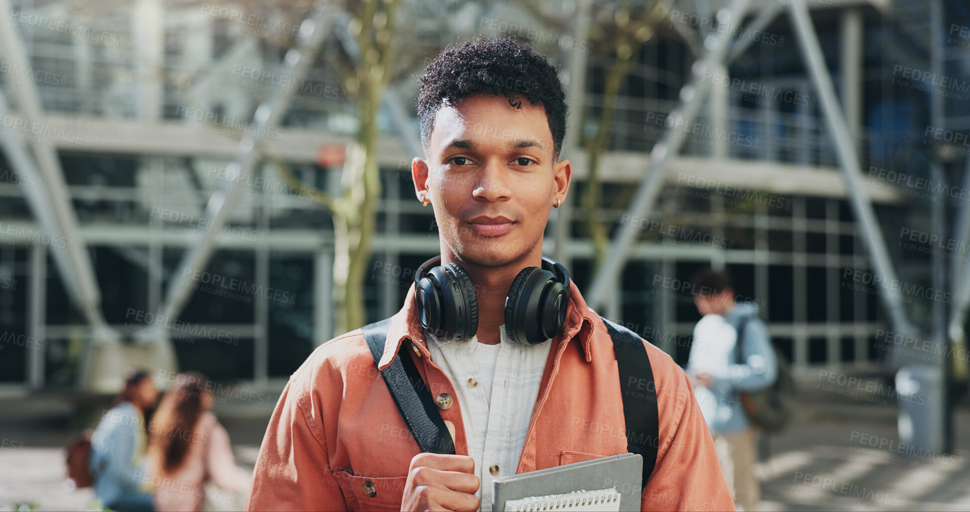 Buy stock photo Man, outdoor and portrait of student on college campus for education, learn and books for studying. Male person, backpack and start of university for knowledge, headphones and institute in Brazil