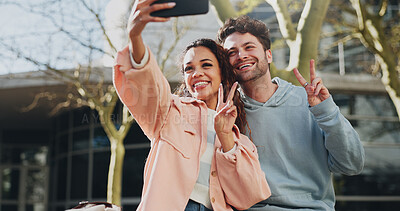 Buy stock photo Happy couple, students and selfie with peace sign for photography, picture or memory at campus. Young, man and woman with smile, emoji or gesture for moment, capture or friendship at university