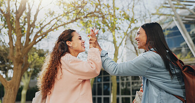 Buy stock photo Outdoor, campus and students with high five for education, exam results and success in english project. University, women and friends with hand gesture for well done, academic support and solidarity