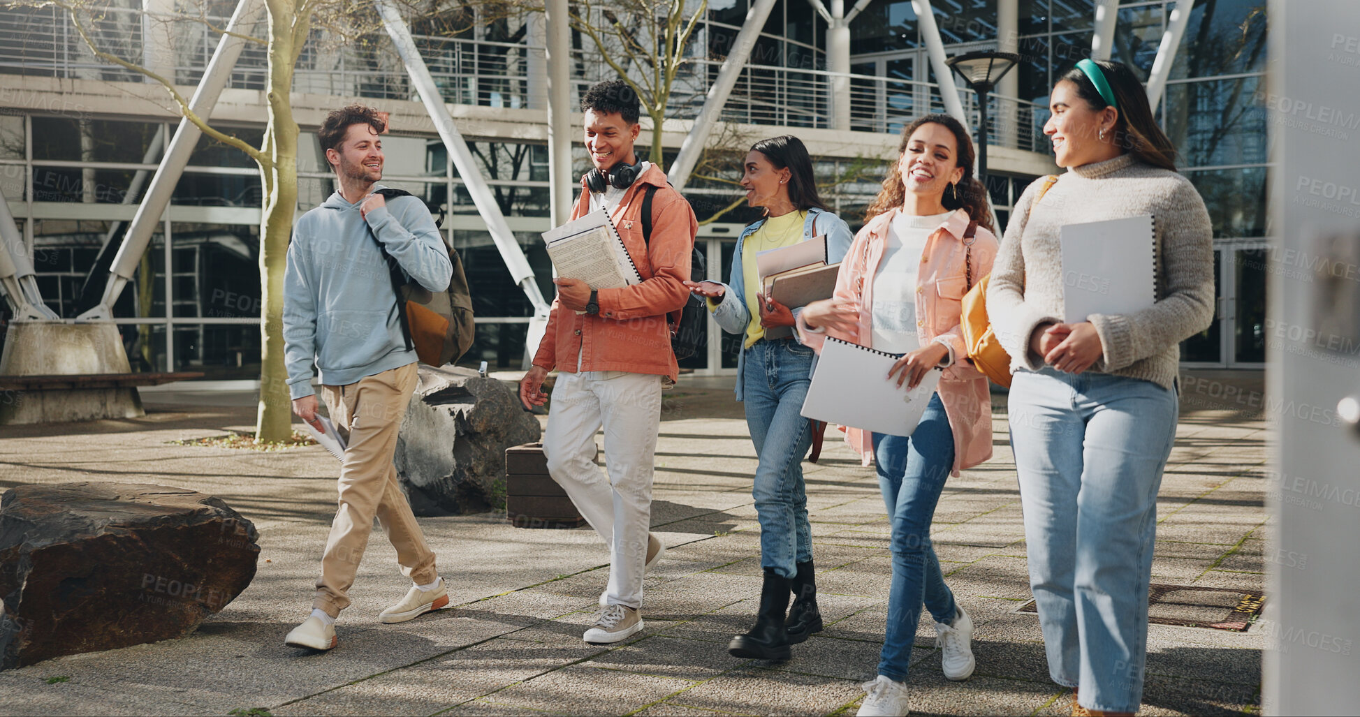 Buy stock photo Education campus, students and walking at university to class with talking, conversation or exam chat. Books, friends or diversity outdoor at college with backpack for learning, scholarship and study