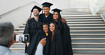 Buy stock photo Students, graduation and happy on campus for photography, support and smile for achievement. Friends, hug or excited at stairs for event, academic success or taking picture for yearbook or local news