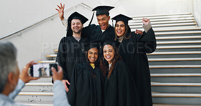 Buy stock photo Students, graduation and excited on campus for photography, support and smile for achievement. Friends, hug or happy at stairs for event, academic success or taking picture for yearbook or local news