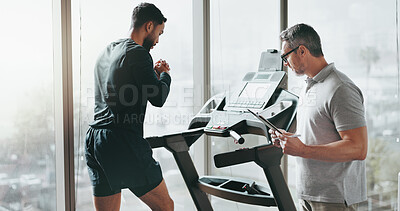 Buy stock photo Fitness, treadmill and man with personal trainer, gym and workout plan in document, training or exercise. Healthy, person and coach with checklist, sports and tracking of progress in club or wellness