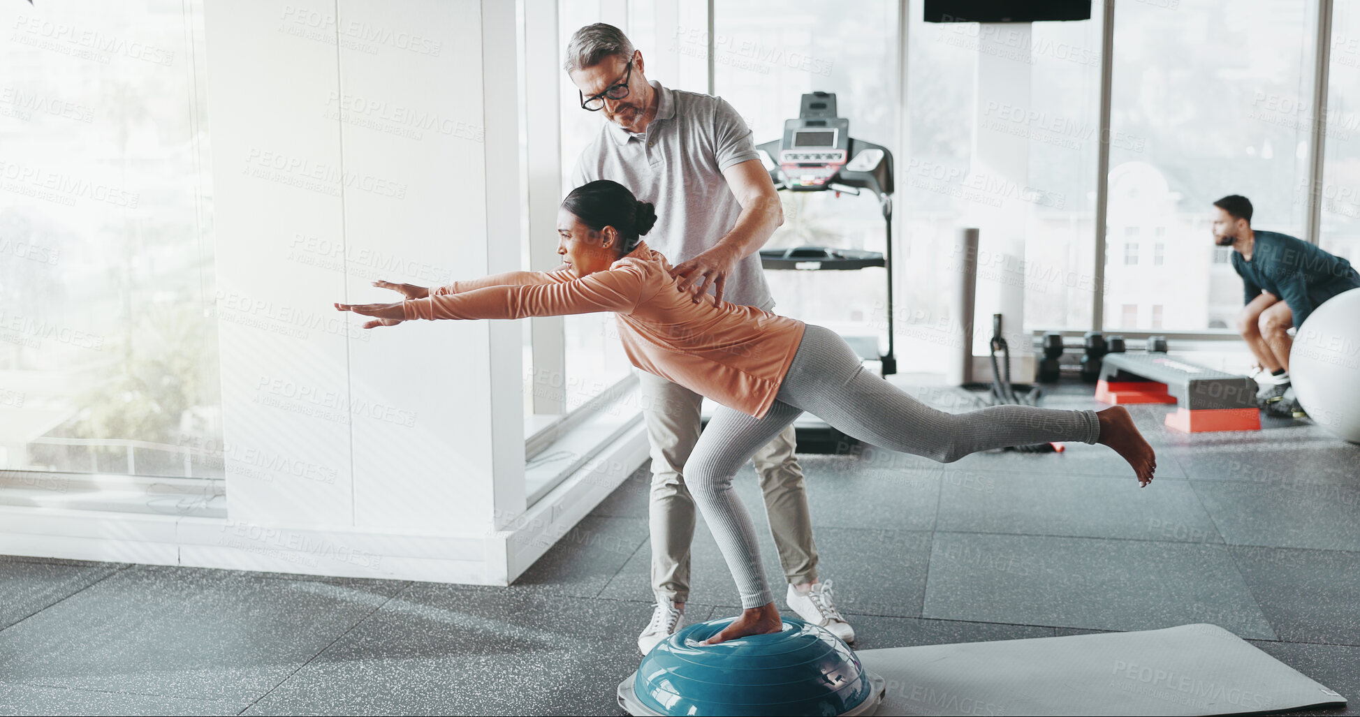 Buy stock photo Physiotherapy, woman and personal trainer in gym for balance, rehabilitation and stability training. Man, client and half ball in fitness center for core strength, yoga practice and help in exercise