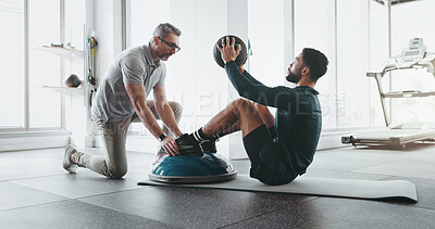 Buy stock photo Personal trainer, fitness and medicine ball in gym with training, exercise and wellness coaching. Professional, support and core workout with abs, gear and athlete at health and sport club together