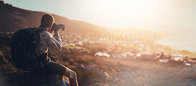 Buy stock photo Photography, nature and man on mountain with camera, memories and adventure for hiking. Professional photographer, outdoor and backpack on cliff with tech, creativity and view of sunset in Brazil