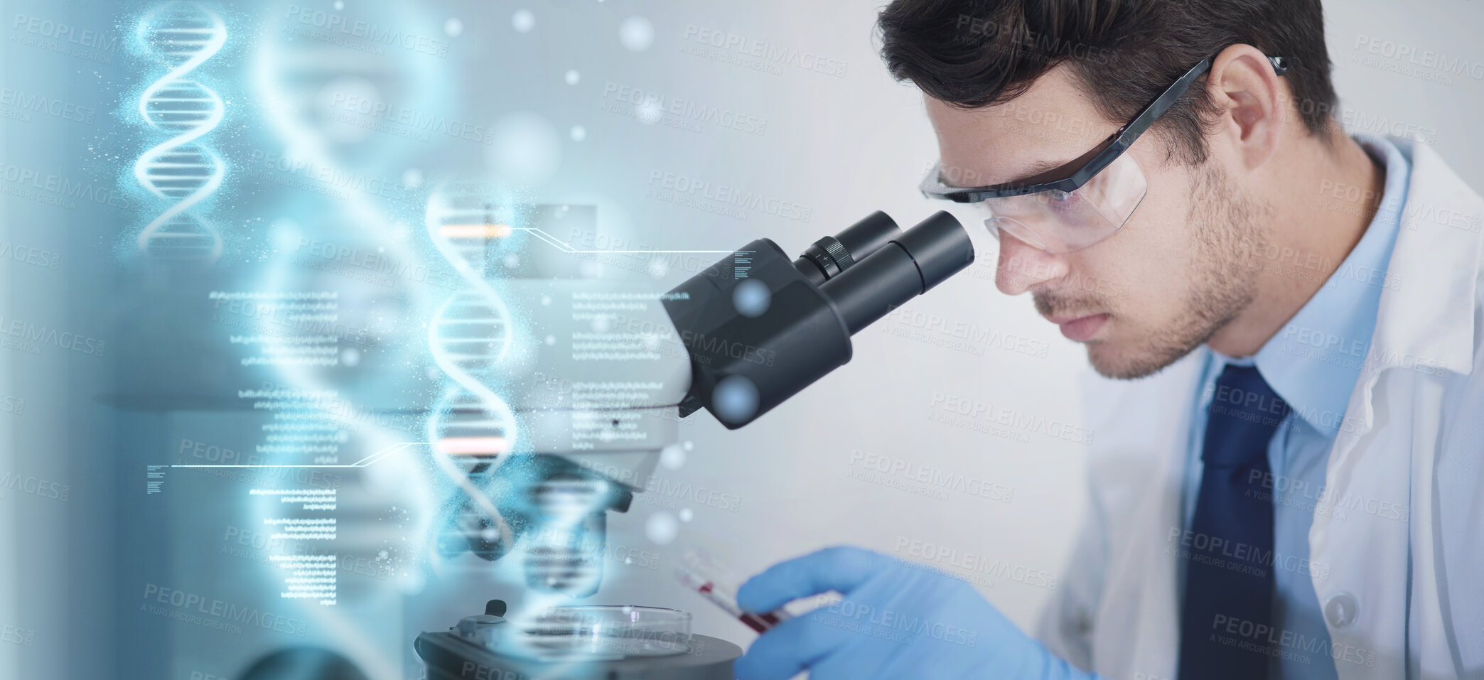 Buy stock photo Cropped shot of a young male scientist working in his lab