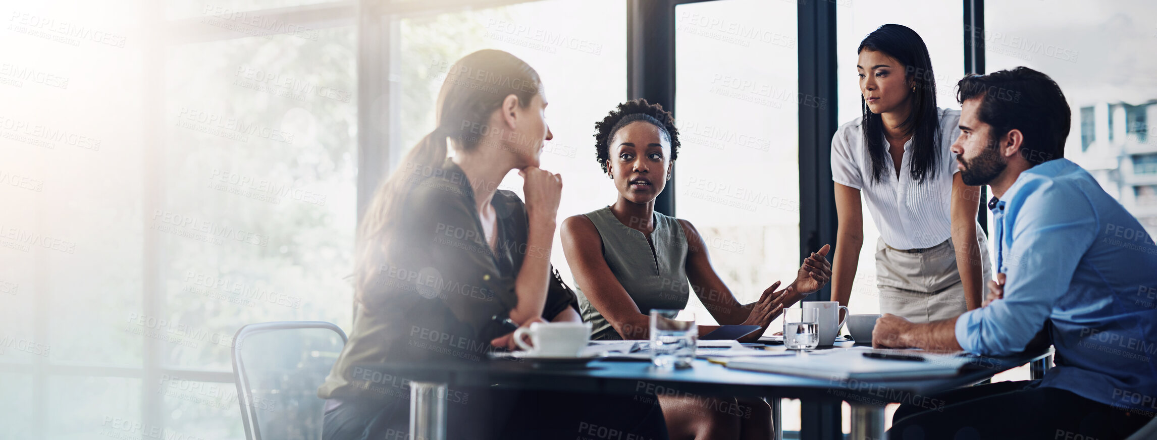 Buy stock photo Shot of a group of businesspeople having a meeting in a boardroom