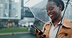 Black woman, smile and phone with umbrella for rain weather, communication and social media of security. Happy, female person and mobile for texting, search location and taxi app of travel outdoor