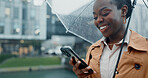 Black woman, commute and phone with umbrella for rain weather, communication and social media of security. Smile, female person and mobile for texting, search location and taxi app of travel outdoor