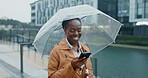 Black woman, smile and phone with umbrella for rain weather, communication and social media of security. Happy, female person and mobile for texting, search location and taxi app of travel outdoor