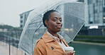 Outside, black woman and thinking with umbrella or coffee in rainy weather for commuting or travel to work. Female person, employee or professional and tea in city with water drops on journey