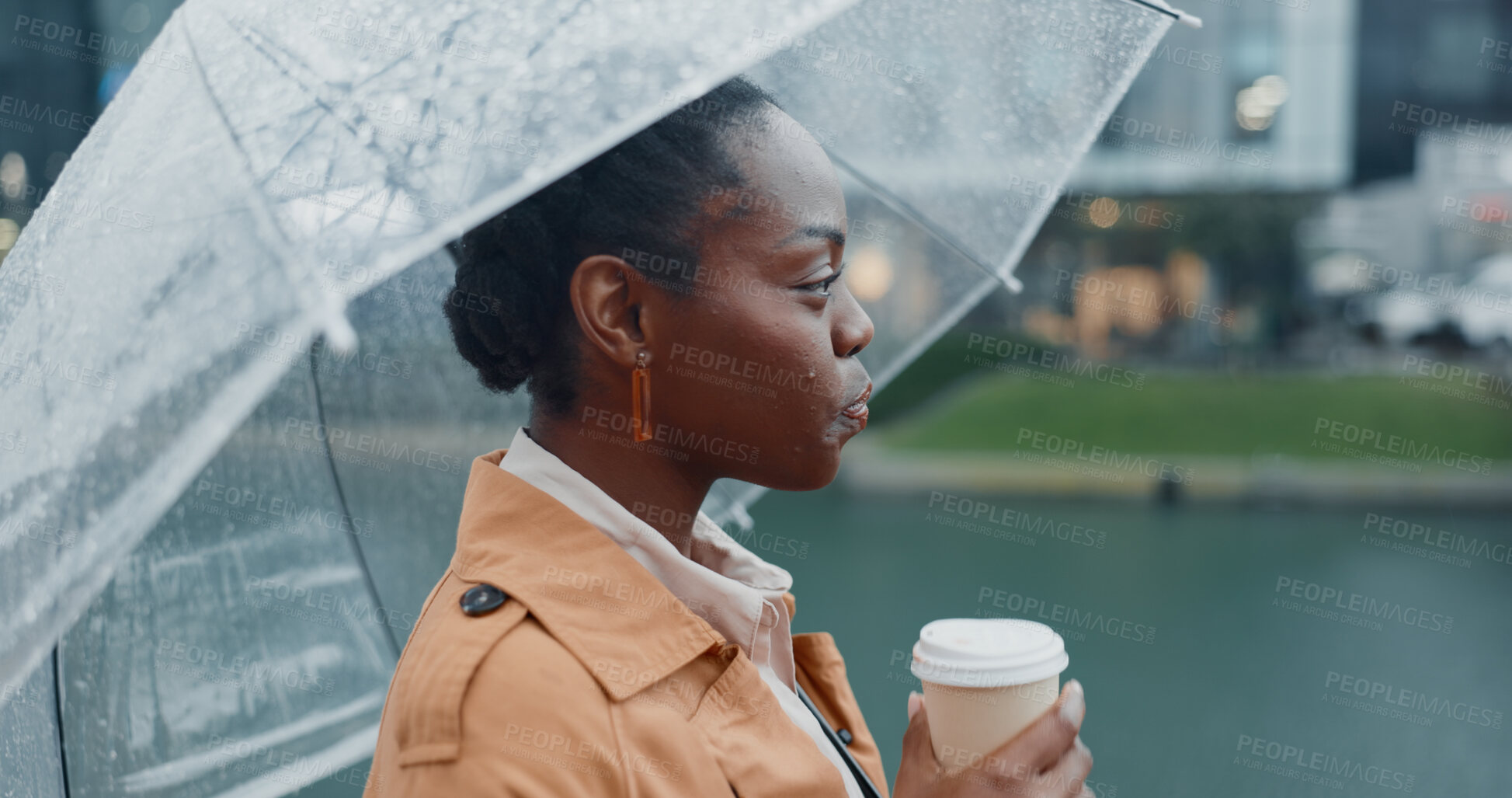 Buy stock photo Outside, black woman and happy with umbrella or coffee in rainy weather for commuting or travel to work. Female employee or professional, profile and thinking tea in city with water drops on journey