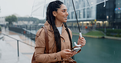 Buy stock photo Woman, outdoor and smile with umbrella on smartphone on mobile app for ehailing for taxi ride. Female person, employee and happy online on website for requesting transportation in city with rain