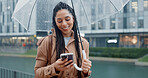 Happy, woman and phone with umbrella for rain weather, communication and social media of security. Smile, female person and mobile for texting contact, search location and taxi app of travel outdoor