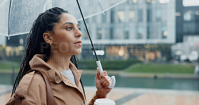 Buy stock photo Outside, woman and thinking with umbrella or coffee in rainy weather for commuting or travel to work. Female person, employee or professional and profile with tea in city with water drops on journey