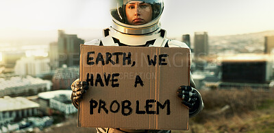 Buy stock photo Cardboard, message and portrait of astronaut in city, outdoor on planet earth for space exploration or sustainability. Helmet, poster and problem with person in galaxy for conservation or recycling