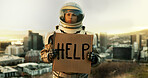 Help, portrait and sign with astronaut in city, outdoor on planet earth for space exploration or sustainability. Face, helmet and poster with interstellar woman in universe for adventure or discovery