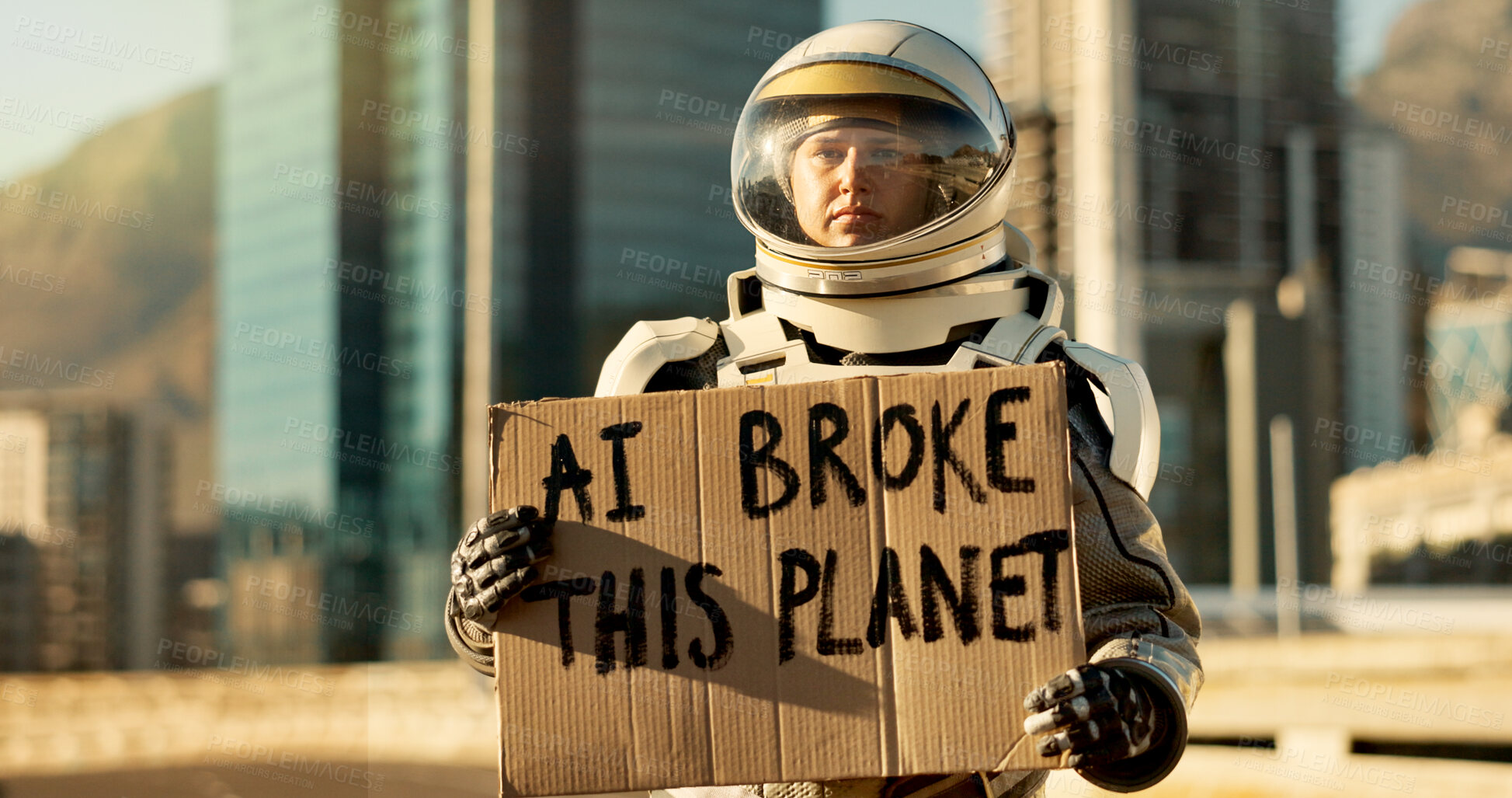 Buy stock photo Astronaut, person and poster with helmet in city for dystopia awareness, message and alert of planet earth. Billboard, cardboard and travel news for future sustainability, protest sign and mission