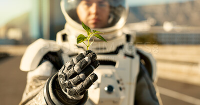 Buy stock photo Person, astronaut and outdoor with plant in city for scientific research, mission and experiment for environment. Safety  gear, outside and portrait for growth, discovery and eco friendly project