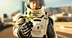 Person, astronaut and outside with plant in city for scientific research, mission and experiment for environment. Safety  gear, outdoor and portrait for growth, discovery and eco friendly project