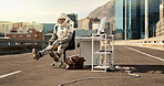 Computer, city and astronaut working in road for business project with interstellar report for mission. Tech, person and space pilot at desk with discovery of civilization on bridge in urban town.