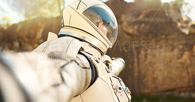 Buy stock photo Astronaut, outdoor and tourism of planet, helmet and suit for protection, explore and mission in mars. Travel, journey and person in trip, spaceman and adventure for discovery, explorer and gravity