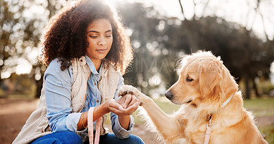 Buy stock photo Portrait, woman and dog in park, smile and bonding together with happiness, comfort and cheerful. Face, outdoor and girl with pet lover, check paw and animal with trees, carefree and weekend break