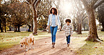 Walking, dog and mother in park, boy and bonding together with wellness, fitness and nature. Family, parent and holding hands with son, mama or pet lover with happiness, cheerful or joyful with smile