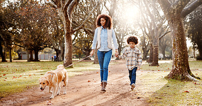 Buy stock photo Walking, dog and mother in park, boy and bonding together with wellness, fitness and nature. Family, parent and holding hands with son, mama or pet lover with happiness, cheerful or joyful with smile