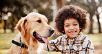 Portrait, boy and dog in park, smile and bonding together with happiness, comfort and cheerful. Face, outdoor and kid with pet lover, childhood and animal with trees, carefree and weekend break