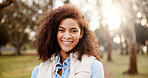 Portrait, outdoor and woman with smile, nature and carefree with weekend break. volunteer and routine. Brazil, person and girl in park, cheerful and joy with trees, sunshine and holiday with freedom