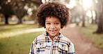 Portrait, boy and black kid in park, smile and afro with nature, playing and happiness with weekend break. African child, outdoor and excited with joy, cheerful and walking for wellness and calm