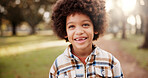 Portrait, boy and black kid in park, joy and afro with nature, playing and happiness with weekend break. African child, outdoor and excited with peace, cheerful and walking for wellness and carefree