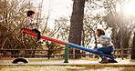 Park, mother and child with seesaw, playground and game with family balance and holiday with parent care, Support, love, care with young boy and woman together with joy, bonding and smile in autumn