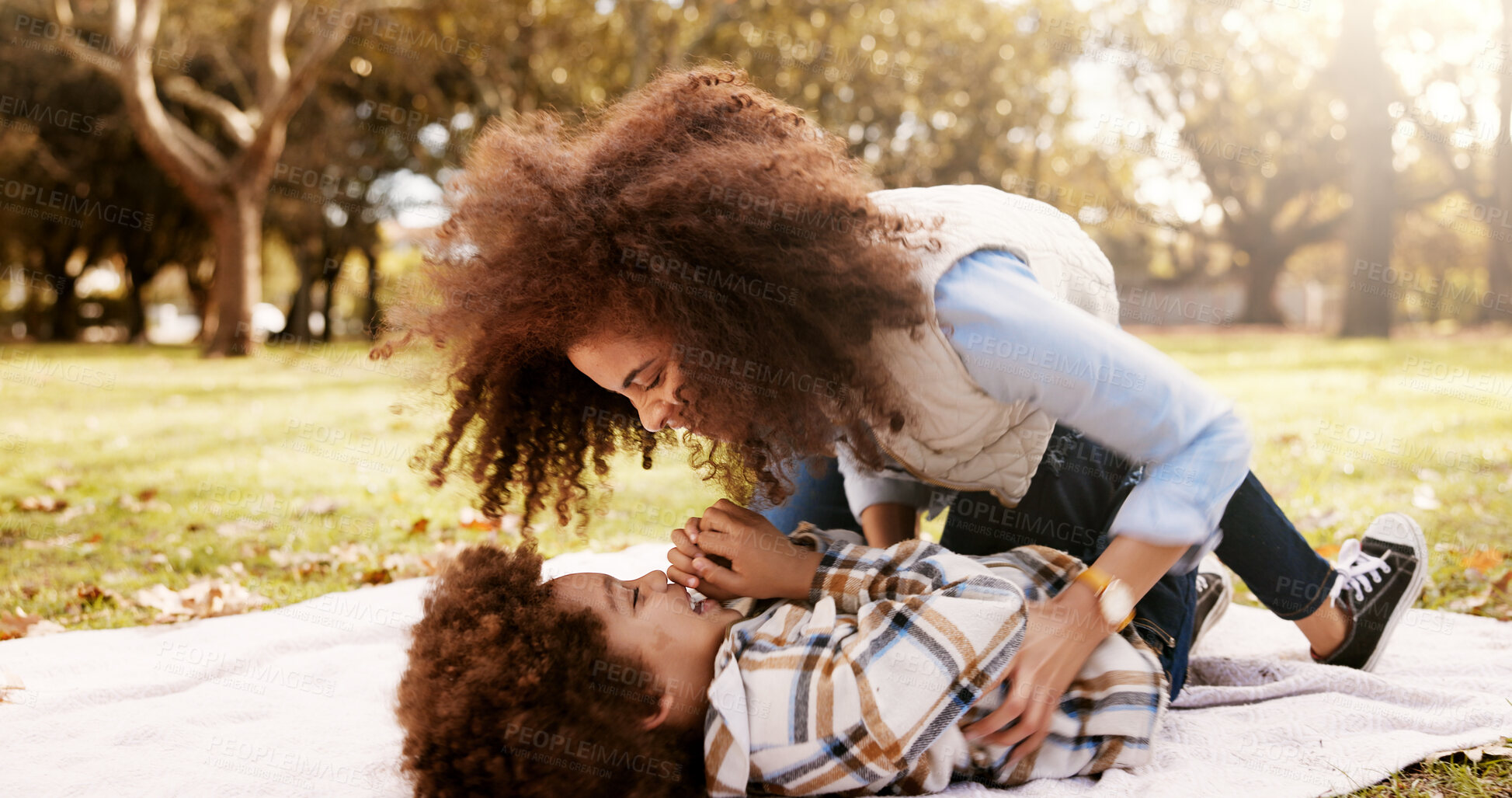 Buy stock photo Tickle, playing and mom in park with child for bonding, outdoor fun and laughing on blanket. Picnic, relax and happy woman with son in nature for playful morning together with love, support and trust