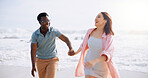 Laugh, holding hands and happy with interracial couple at beach for travel destination, summer and honeymoon vacation. Relax, tropical and adventure with man and woman for holiday, bonding or romance
